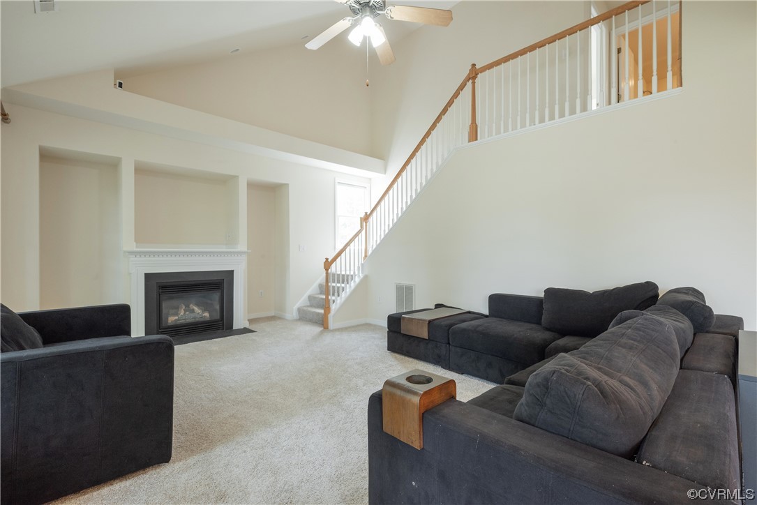 4917 Chappell Ridge Terrace Glen Allen, VA 23059 - Photo 23 of 50 a living room with furniture a fireplace and a flat screen tv