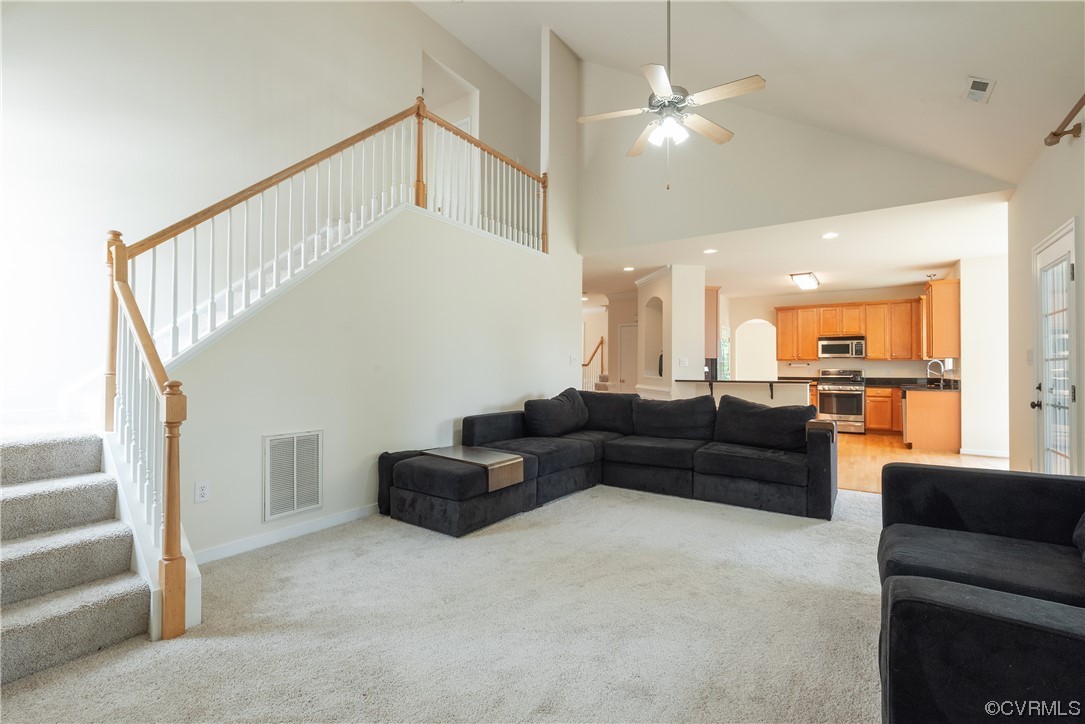4917 Chappell Ridge Terrace Glen Allen, VA 23059 - Photo 24 of 50 a living room with furniture and a chandelier