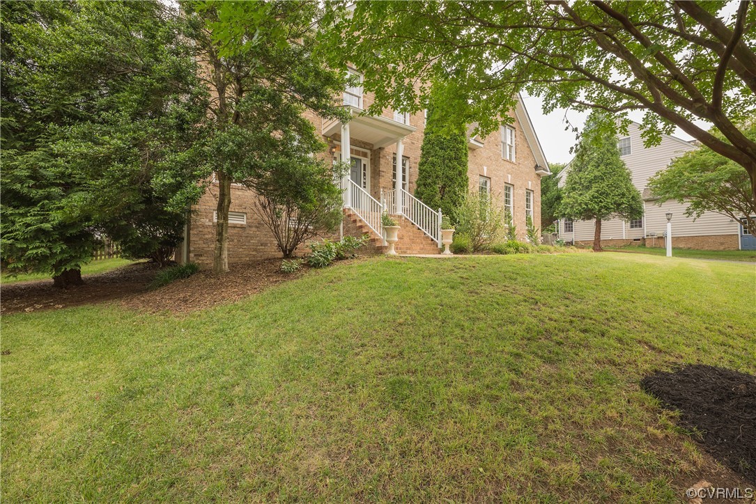 4917 Chappell Ridge Terrace Glen Allen, VA 23059 - Photo 3 of 50 a view of a trees in front of a house