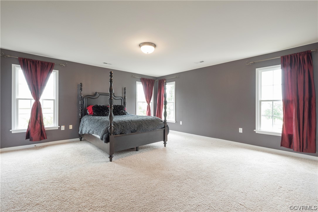 4917 Chappell Ridge Terrace Glen Allen, VA 23059 - Photo 34 of 50 a bedroom with a bed and a large window