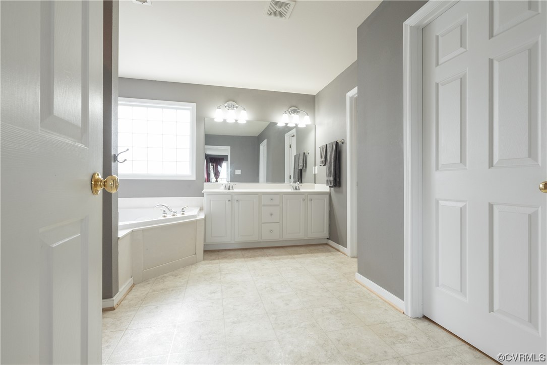 4917 Chappell Ridge Terrace Glen Allen, VA 23059 - Photo 36 of 50 a view of a hallway to a kitchen