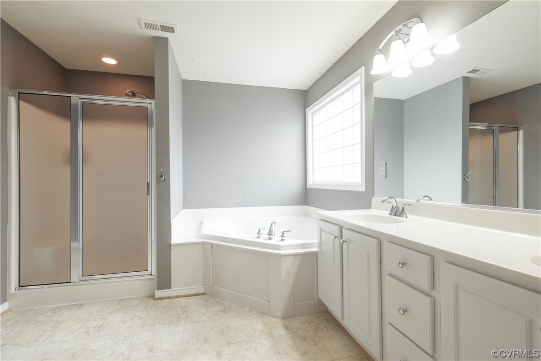4917 Chappell Ridge Terrace Glen Allen, VA 23059 - Photo 37 of 50 a bathroom with a sink double vanity mirror and a bathtub