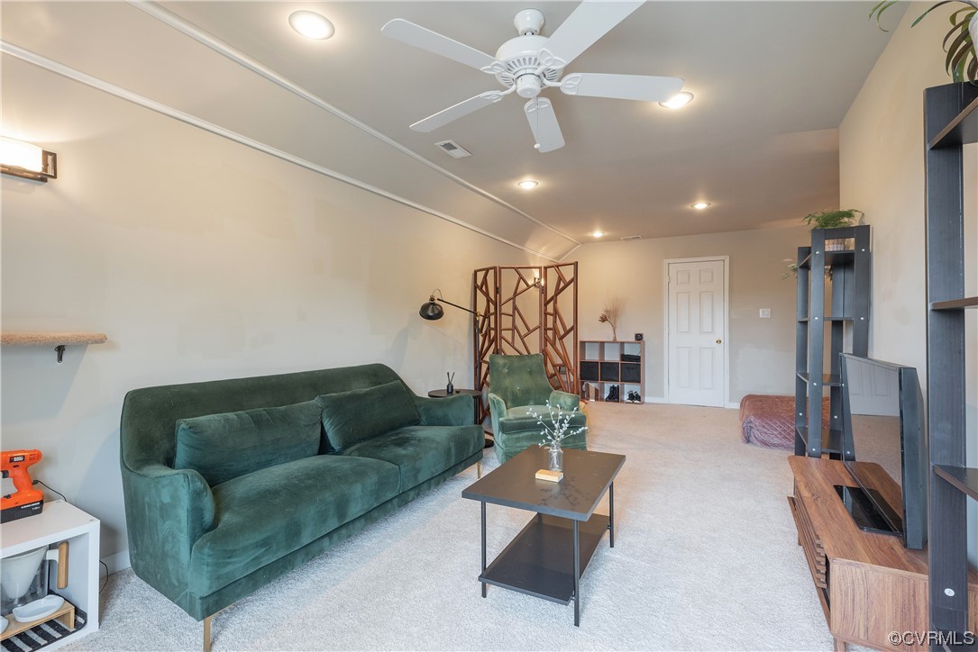 4917 Chappell Ridge Terrace Glen Allen, VA 23059 - Photo 40 of 50 a living room with furniture and a chandelier