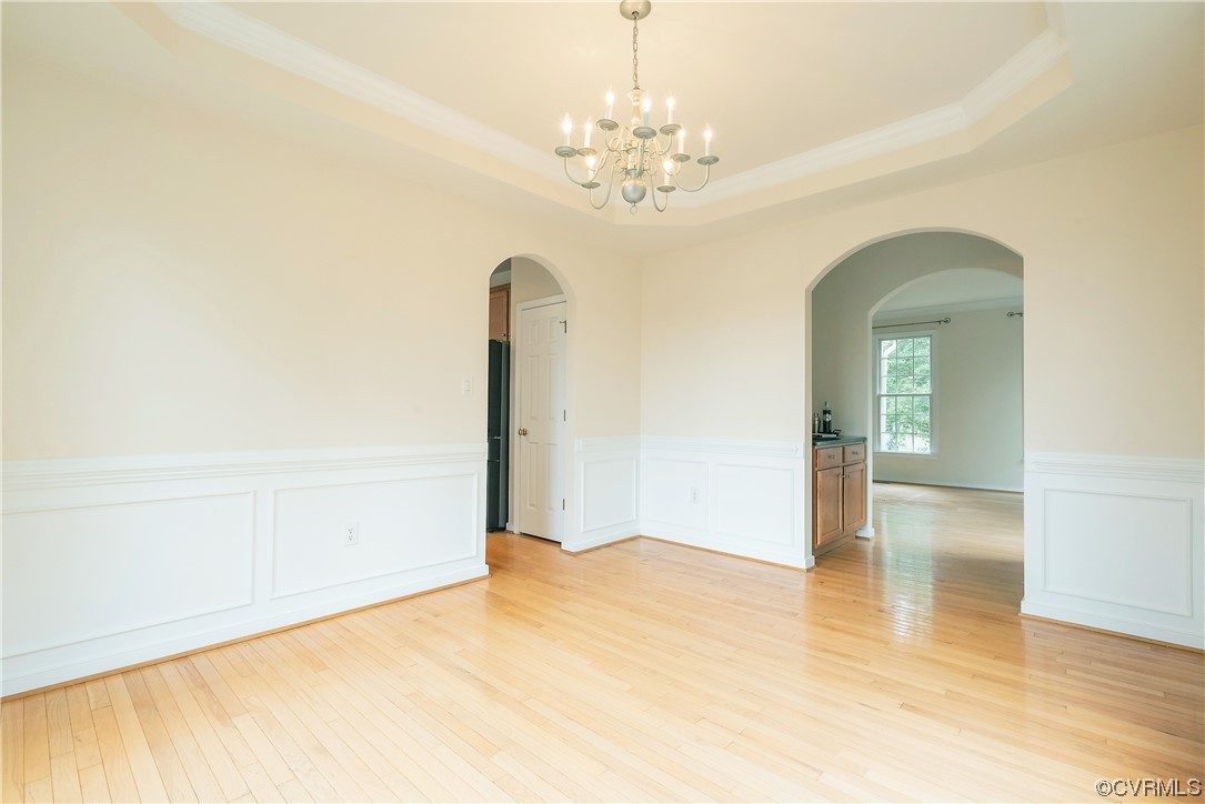 4917 Chappell Ridge Terrace Glen Allen, VA 23059 - Photo 9 of 50 a view of a livingroom with a chandelier fan and wooden floor