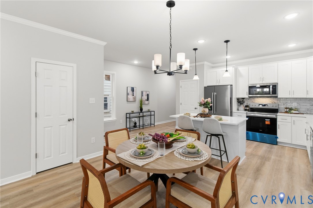 1430 Decatur Street Richmond, VA 23224 - Photo 11 of 37 Open-concept living space with wood-finish floorin