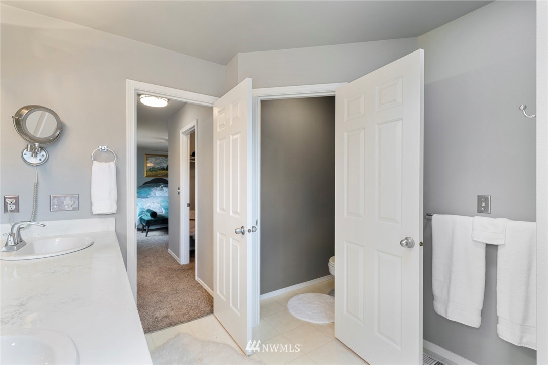 5030 Northeast 4th Place Renton, WA 98059 - Photo 22 of 35 a bathroom with a sink toilet and shower