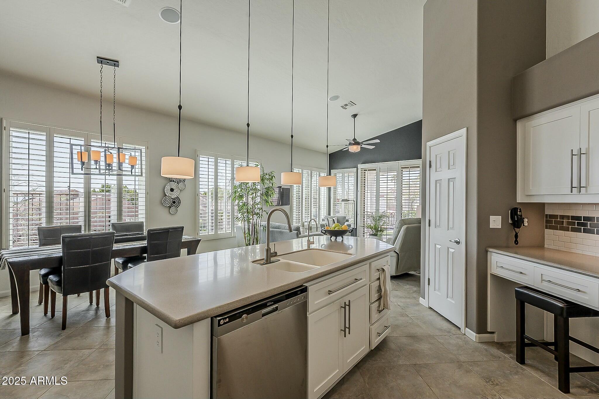6334 East Viewmont Drive, Unit 29 Mesa, AZ 85215 - Photo 15 of 47 a kitchen with sink cabinets and window