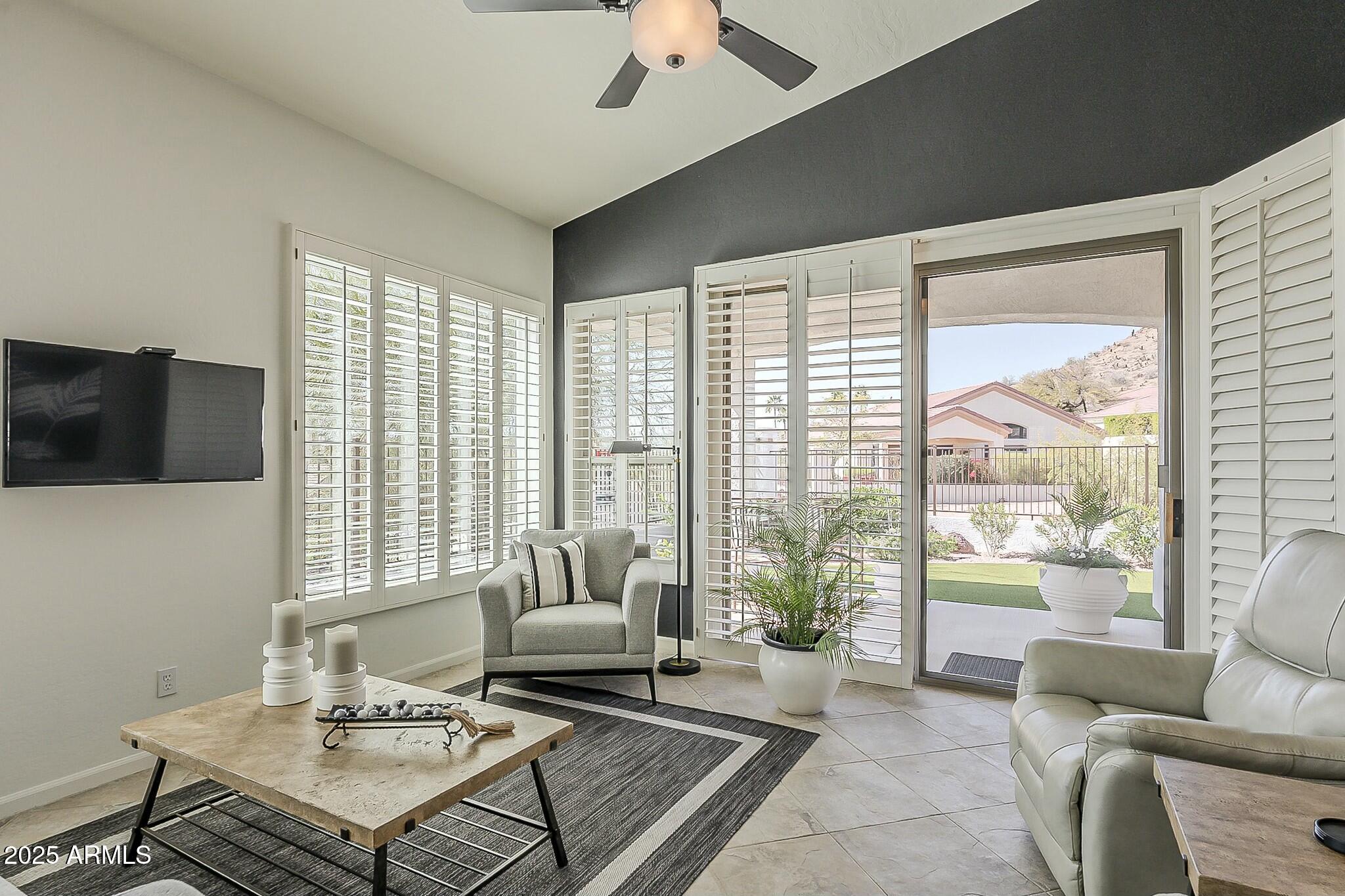 6334 East Viewmont Drive, Unit 29 Mesa, AZ 85215 - Photo 17 of 47 a living room with furniture and a large window