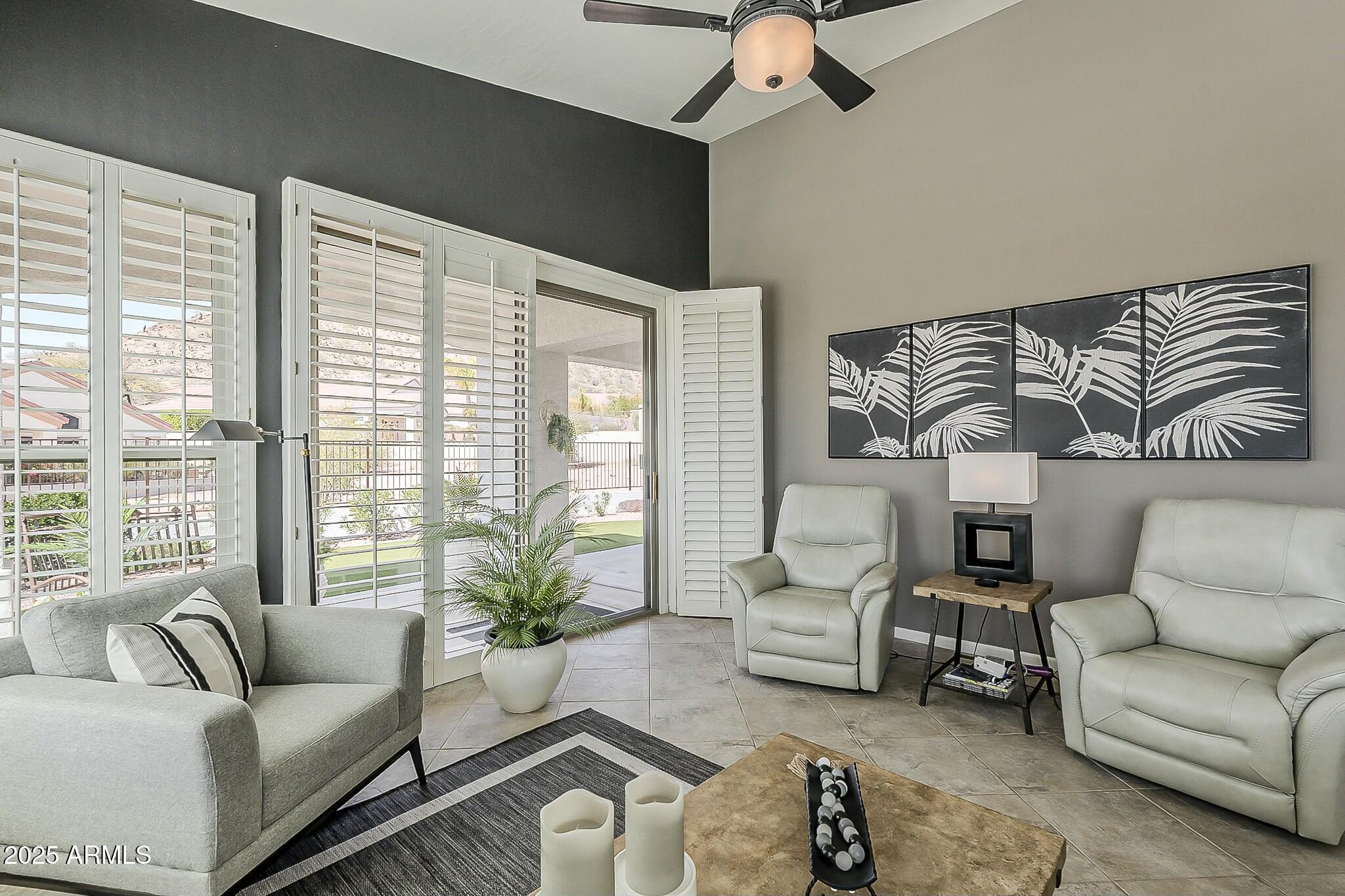 6334 East Viewmont Drive, Unit 29 Mesa, AZ 85215 - Photo 18 of 47 a living room with furniture and a large window