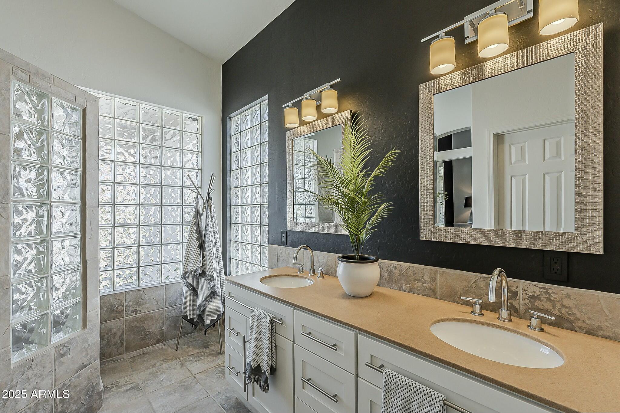 6334 East Viewmont Drive, Unit 29 Mesa, AZ 85215 - Photo 22 of 47 a bathroom with a sink double vanity and a shower