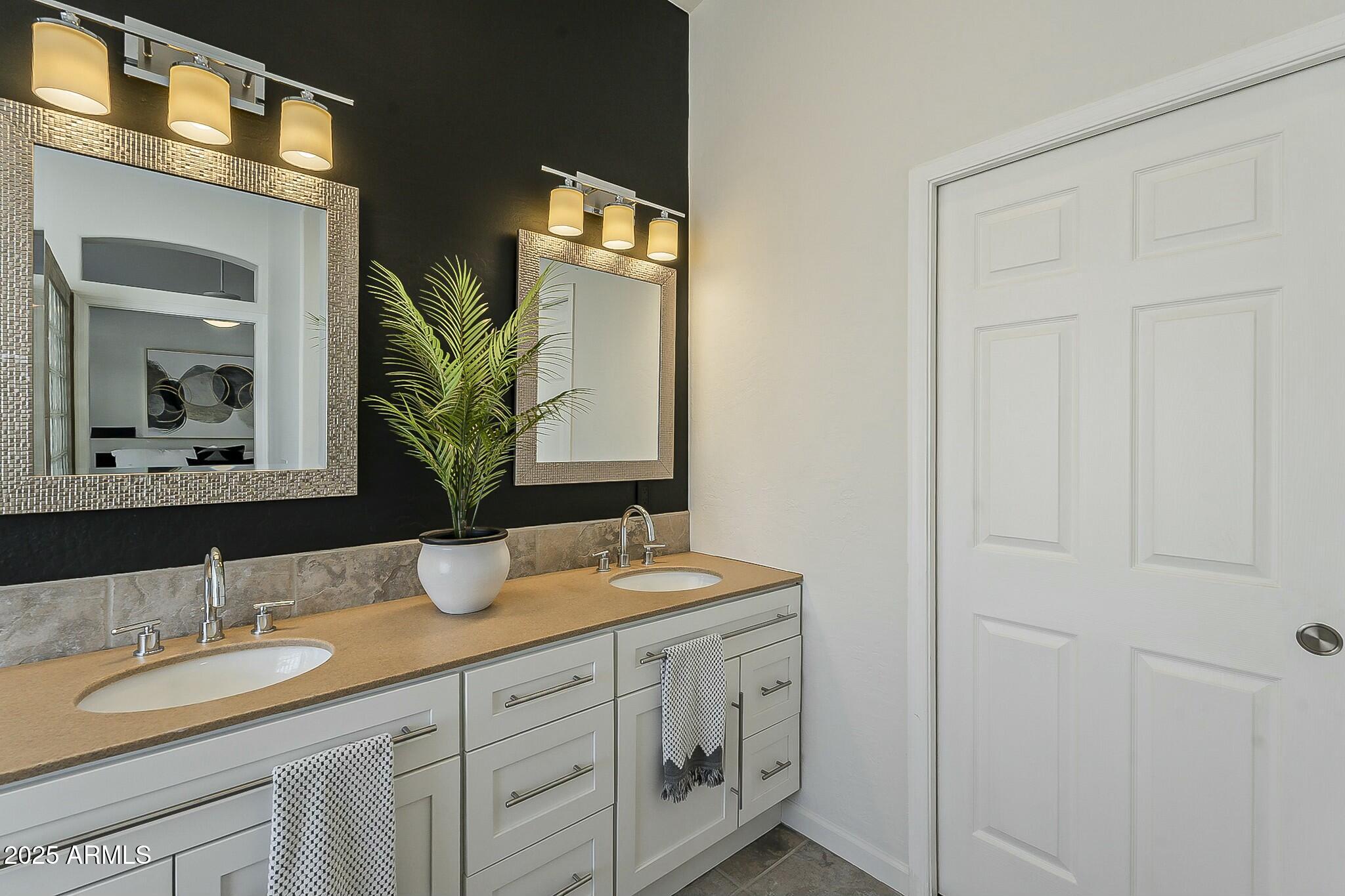 6334 East Viewmont Drive, Unit 29 Mesa, AZ 85215 - Photo 23 of 47 a bathroom with double vanity sinks and a mirror