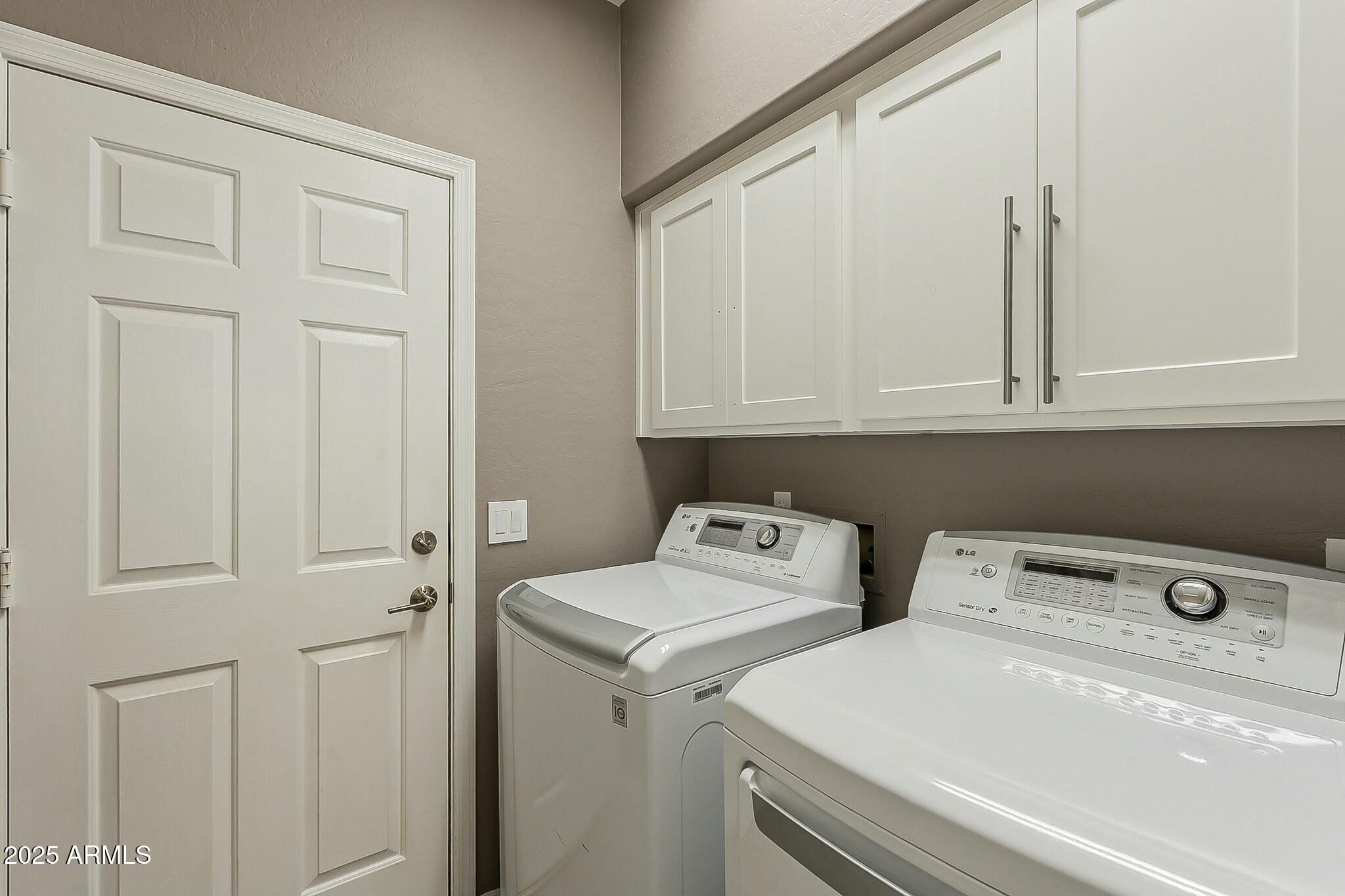 6334 East Viewmont Drive, Unit 29 Mesa, AZ 85215 - Photo 29 of 47 a utility room with dryer and washer