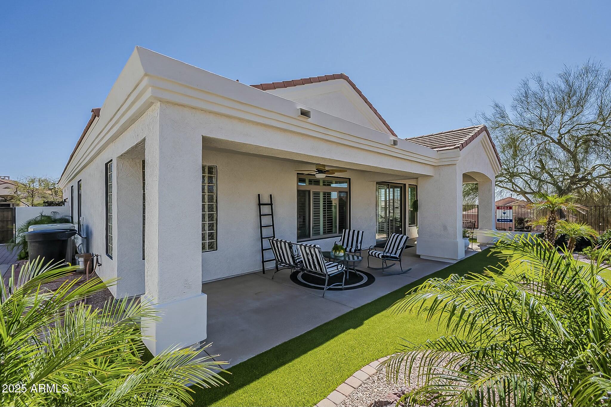 6334 East Viewmont Drive, Unit 29 Mesa, AZ 85215 - Photo 31 of 47 a view of a house with swimming pool and sitting area