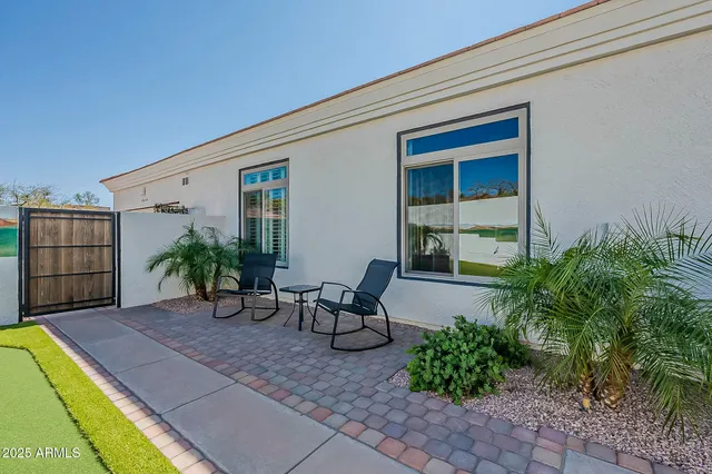 a backyard of a house with seating space
