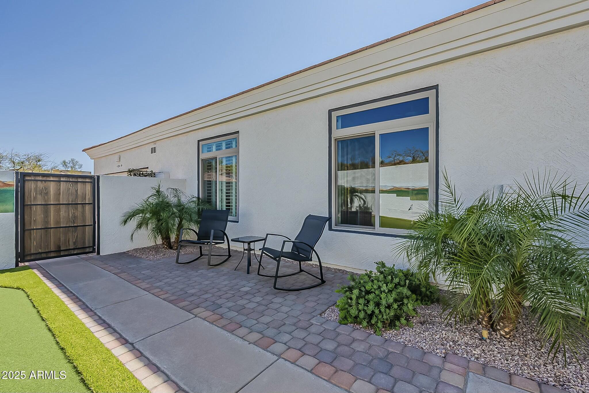 6334 East Viewmont Drive, Unit 29 Mesa, AZ 85215 - Photo 36 of 47 a backyard of a house with seating space
