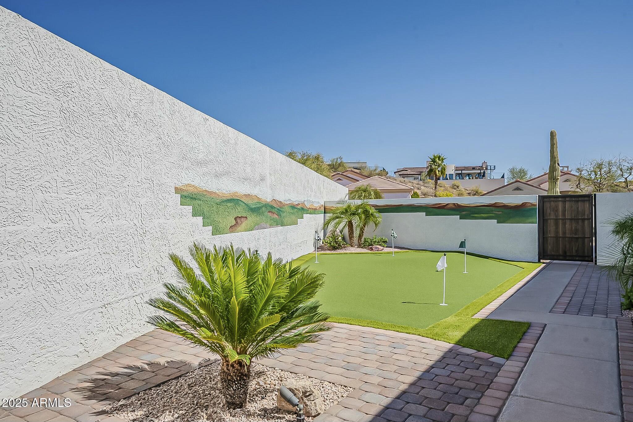 6334 East Viewmont Drive, Unit 29 Mesa, AZ 85215 - Photo 38 of 47 a view of a swimming pool with a yard