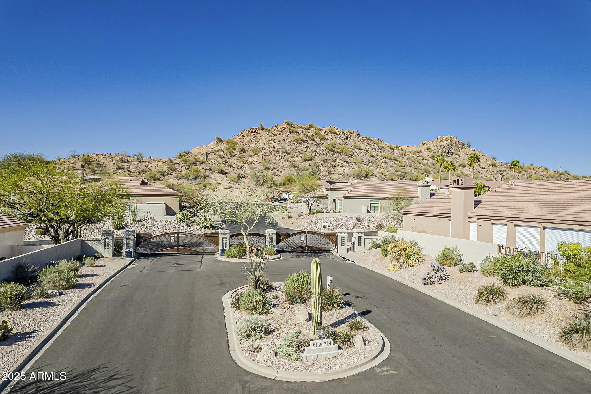 6334 East Viewmont Drive, Unit 29 Mesa, AZ 85215 - Photo 41 of 47 a view of a terrace with furniture and a garden