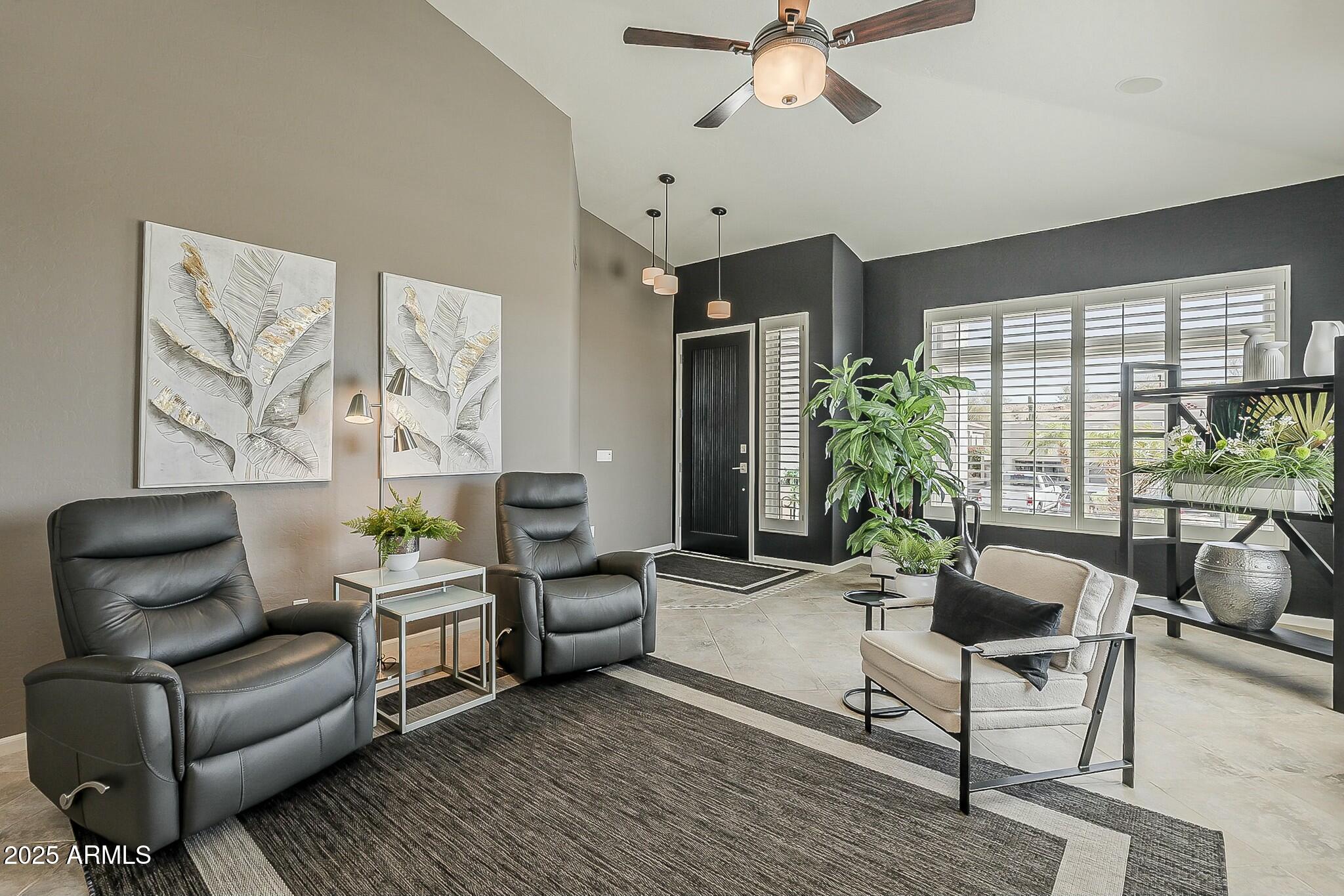 6334 East Viewmont Drive, Unit 29 Mesa, AZ 85215 - Photo 7 of 47 a living room with furniture and a large window