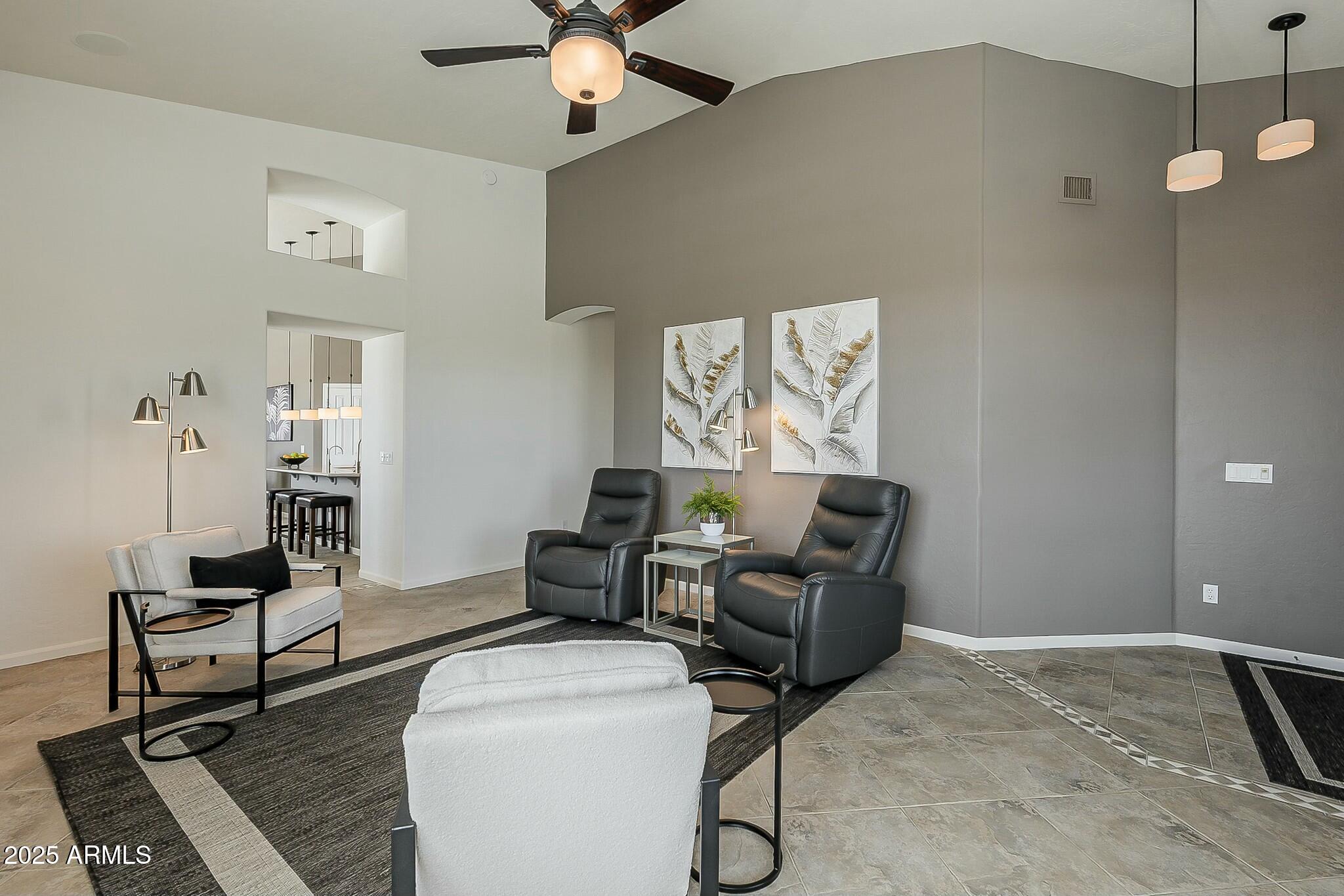 6334 East Viewmont Drive, Unit 29 Mesa, AZ 85215 - Photo 8 of 47 a living room with furniture and a ceiling fan