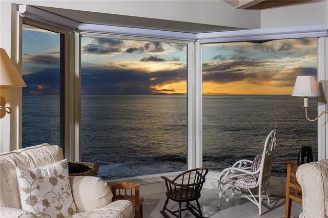 a view of balcony with couple of chairs