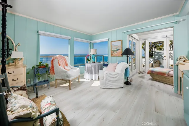 a living room with furniture chess table and a large window