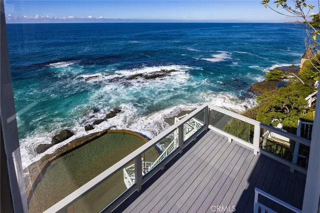 a view of a balcony with an ocean