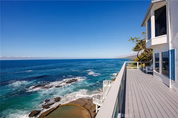 a view of a balcony with ocean view