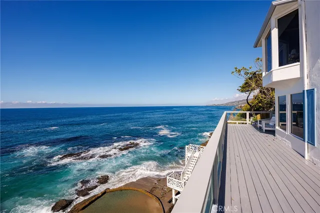 a view of a balcony with ocean view
