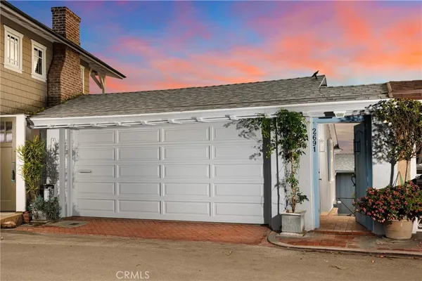a front view of a house with a garage