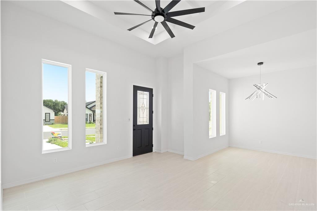 1925 Trinity Street Donna, TX 78537 - Photo 3 of 20 a view of an empty room with a window