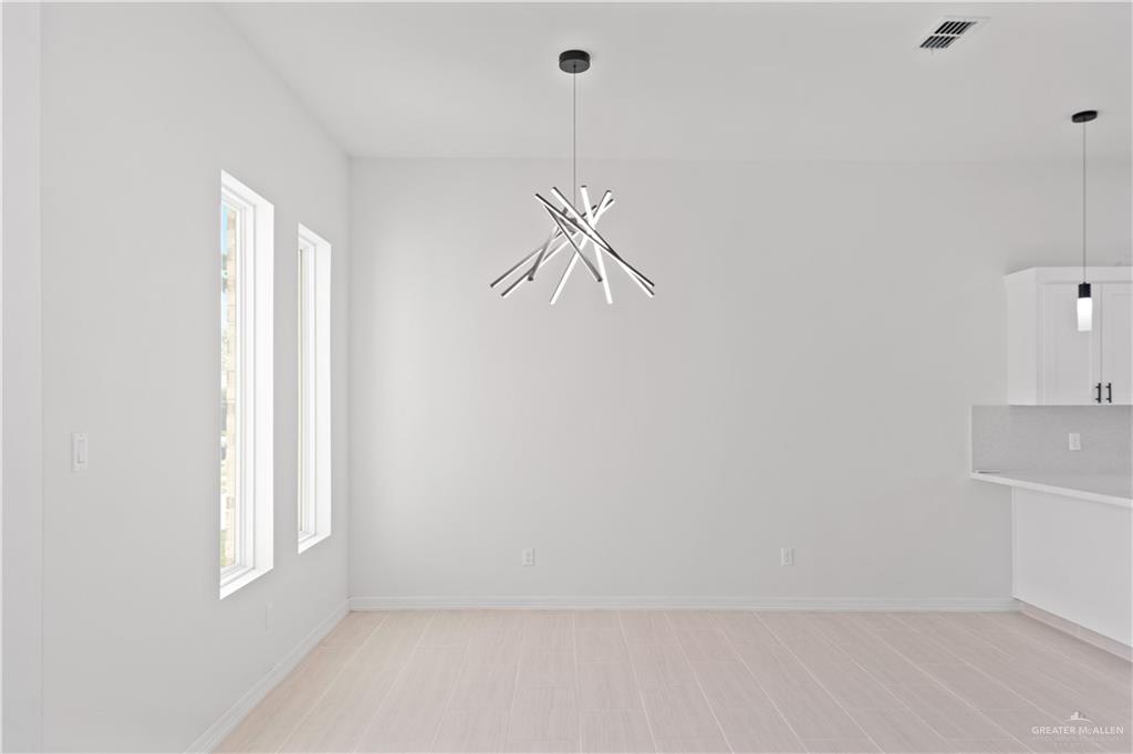1925 Trinity Street Donna, TX 78537 - Photo 4 of 20 a view of an empty room with a window
