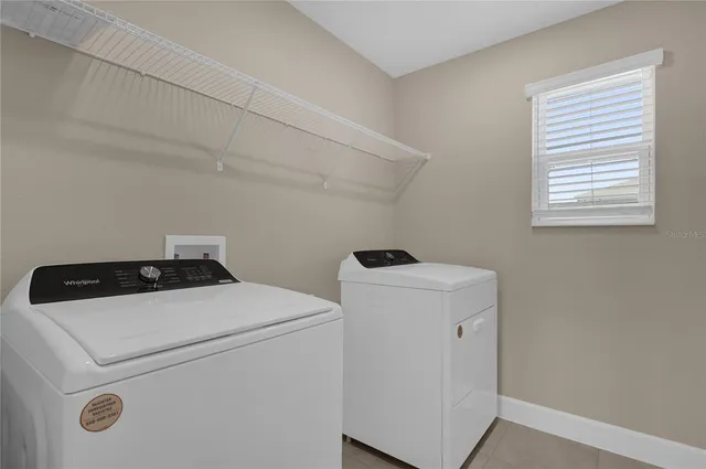 a bathroom with a granite countertop sink a toilet and a bathtub
