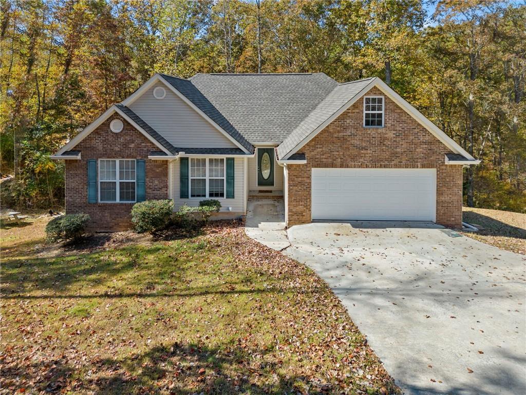 1169 Heads Ferry Road Cornelia, GA 30531 - Photo 1 of 1 View of front of property featuring a front lawn