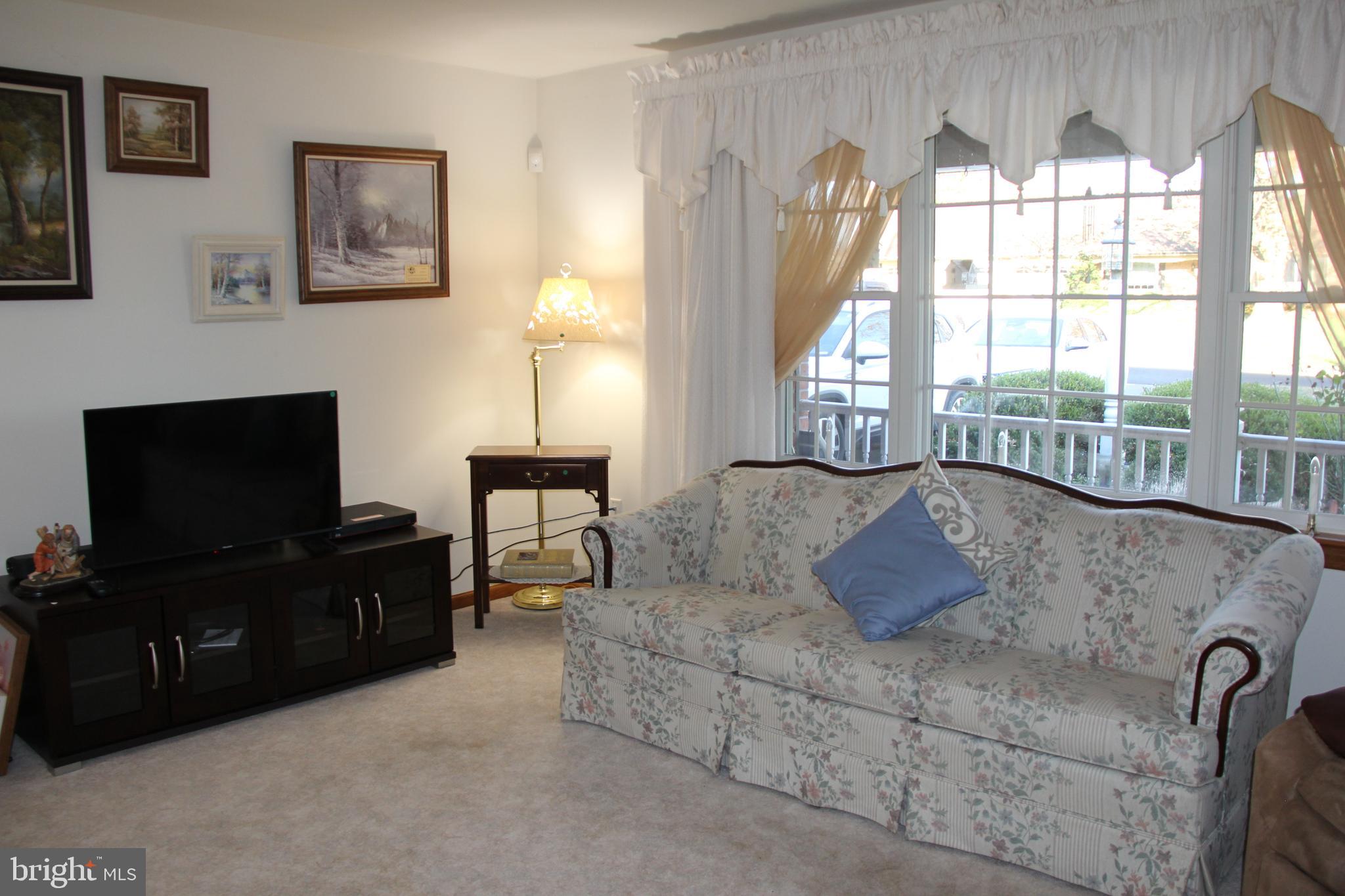 668 Snyder Hill Road Lititz, PA 17543 - Photo 12 of 32 a living room with furniture and a flat screen tv
