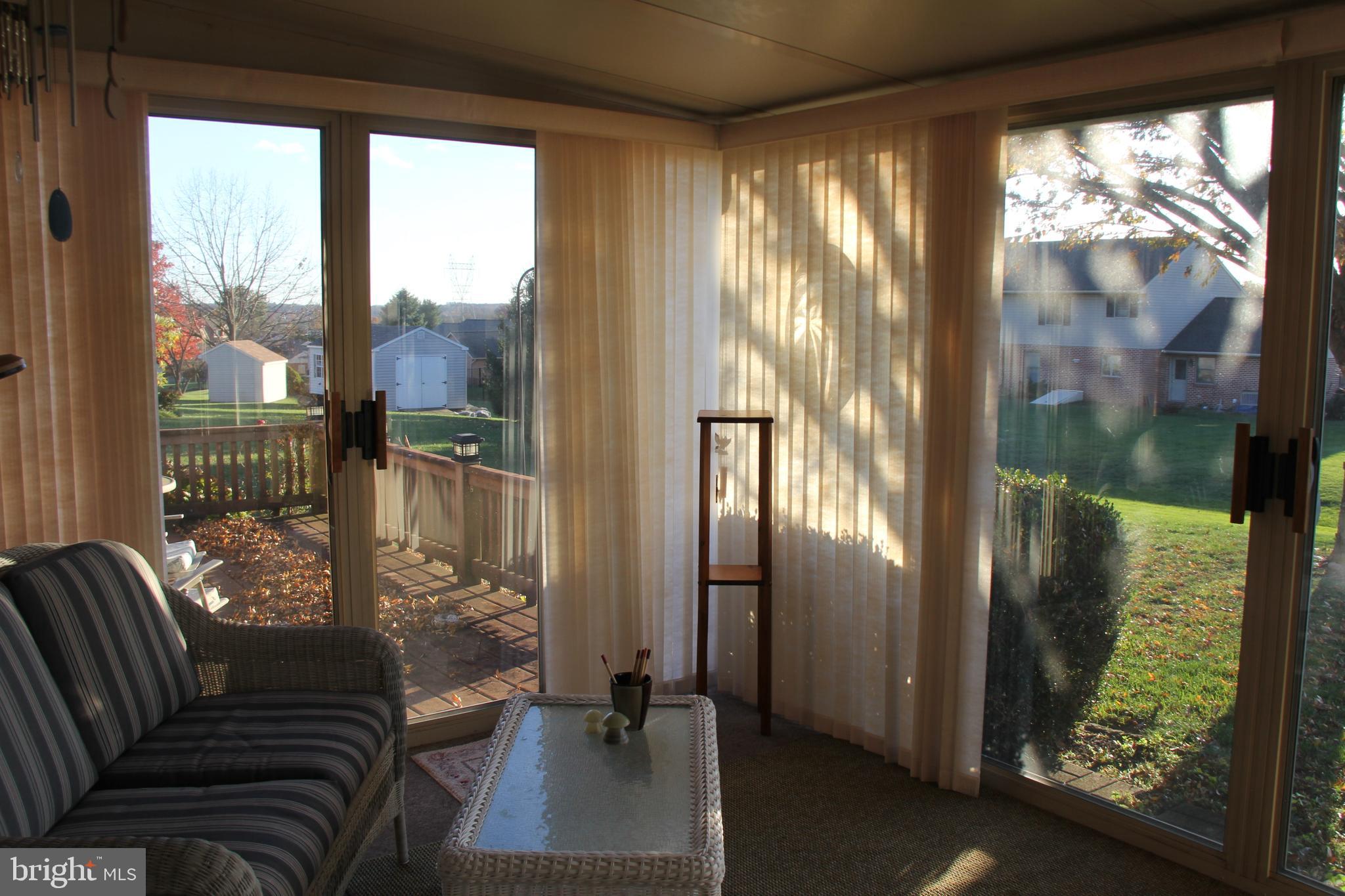 668 Snyder Hill Road Lititz, PA 17543 - Photo 27 of 32 a living room with furniture and a floor to ceiling window