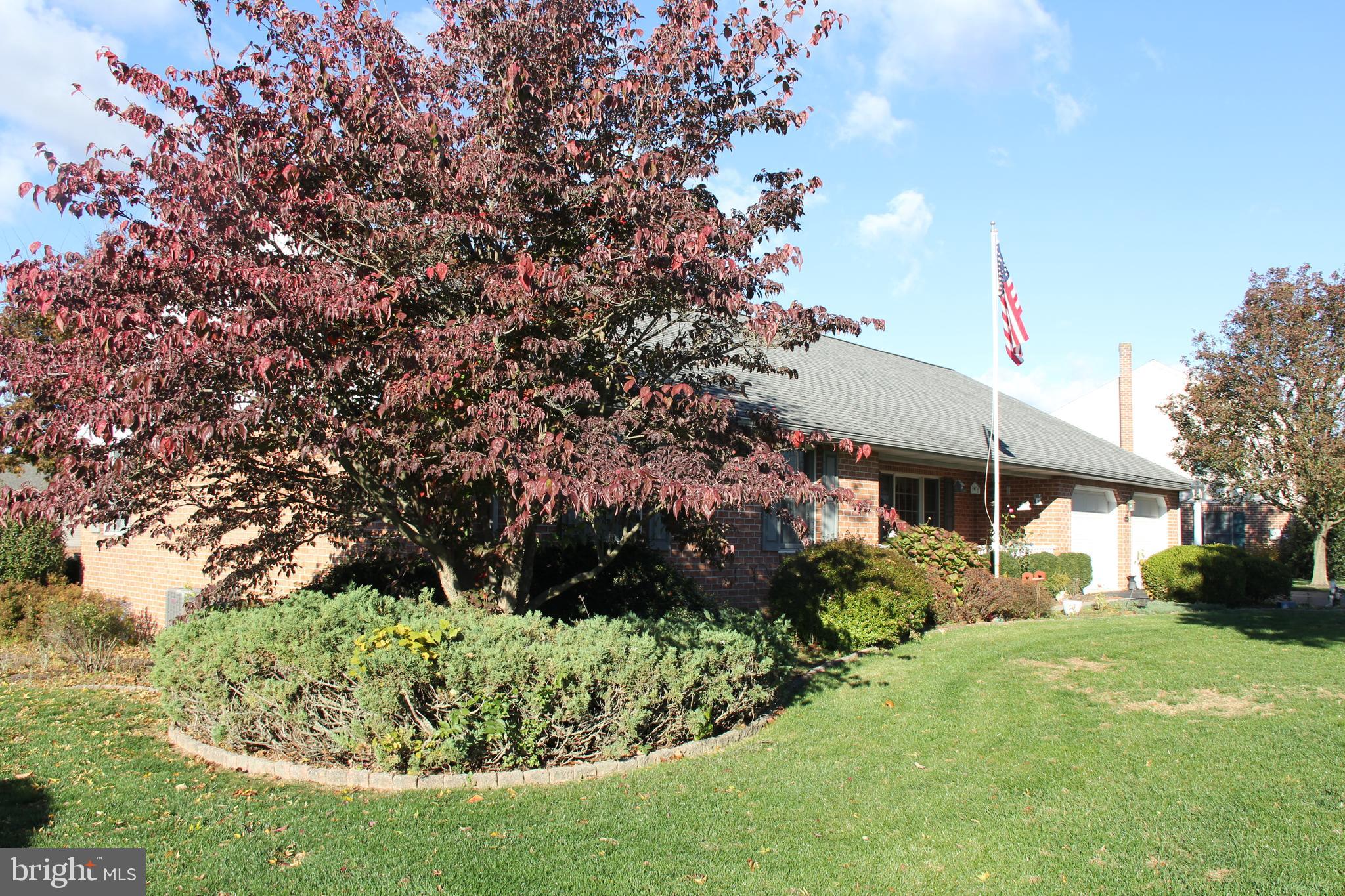 668 Snyder Hill Road Lititz, PA 17543 - Photo 4 of 32 a front view of a house with a yard