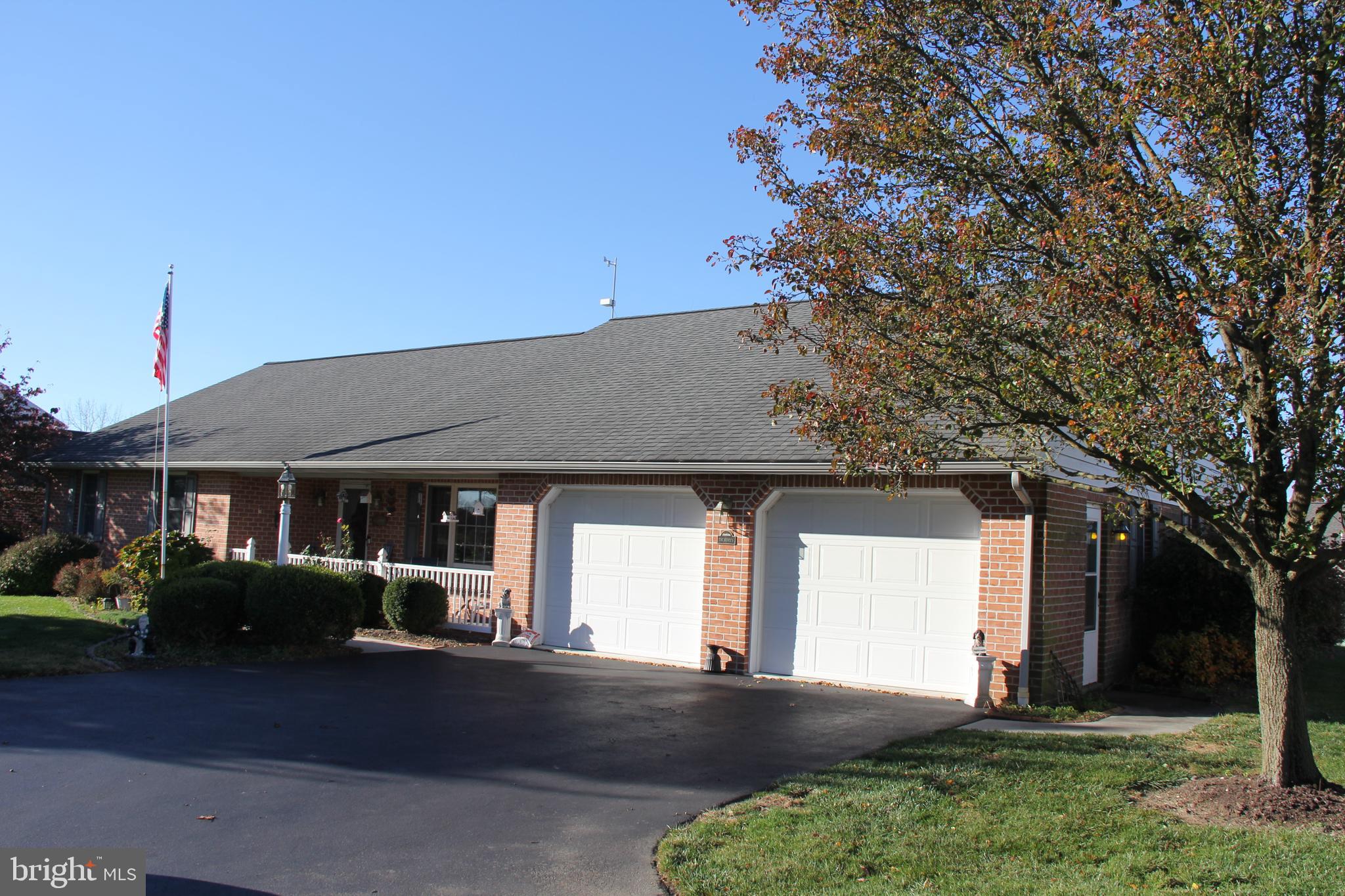 668 Snyder Hill Road Lititz, PA 17543 - Photo 5 of 32 a front view of a house with a yard and trees