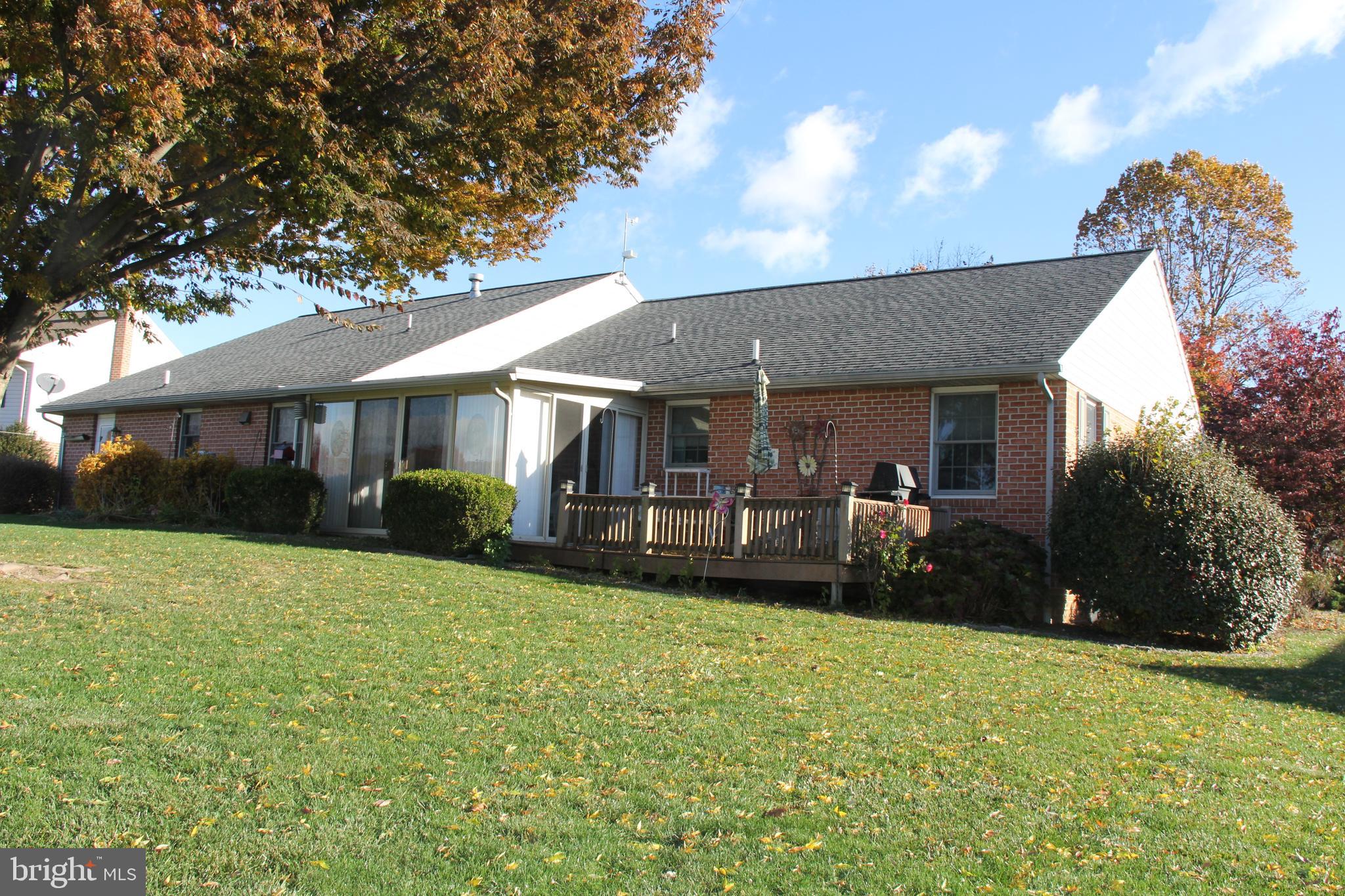 668 Snyder Hill Road Lititz, PA 17543 - Photo 7 of 32 a view of a house with a yard and sitting area