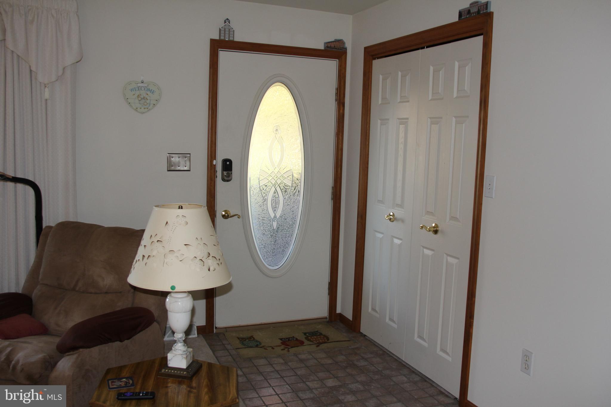 668 Snyder Hill Road Lititz, PA 17543 - Photo 10 of 32 a view of a livingroom with furniture and a mirror