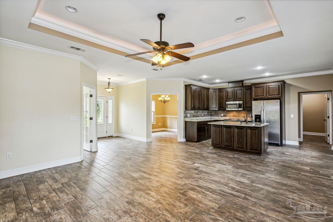 5201 Mayburn Bridge Road Milton, FL 32570 - Photo 5 of 41 a view of kitchen with refrigerator and cabinets