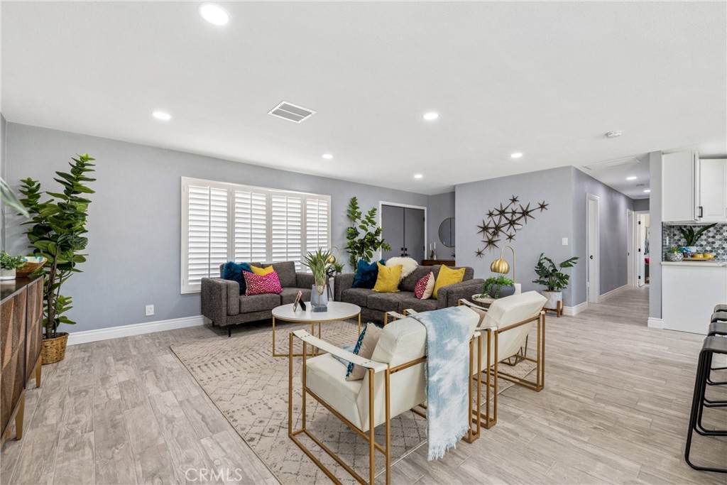 373 East Simms Road Palm Springs, CA 92262 - Photo 13 of 24 a living room with furniture stairs and a potted plant