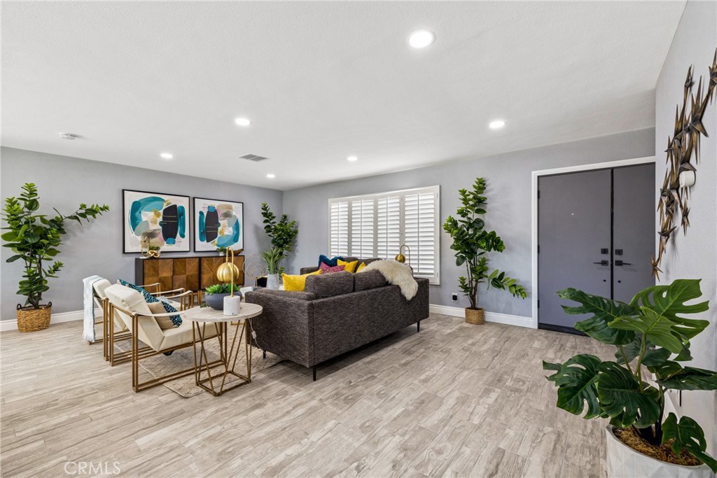 373 East Simms Road Palm Springs, CA 92262 - Photo 9 of 24 a living room with furniture and a potted plant