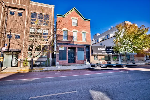 a front view of a building with street view