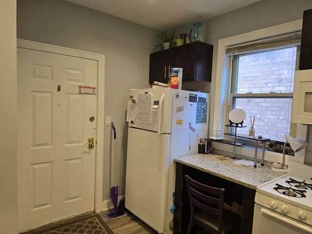 a kitchen with stainless steel appliances a refrigerator stove and sink