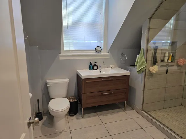 a bathroom with a sink toilet and mirror