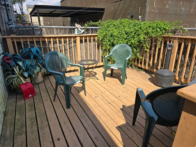a view of a chairs on the roof deck