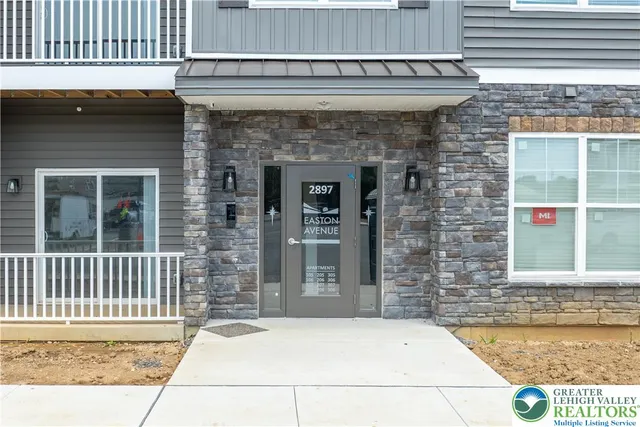 a front view of a house with a glass door