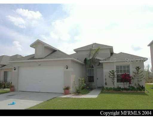 1509 Ocean Reef Road Wesley Chapel, FL 33544 - Photo 1 of 1 a view of a white house with a big yard and potted plants