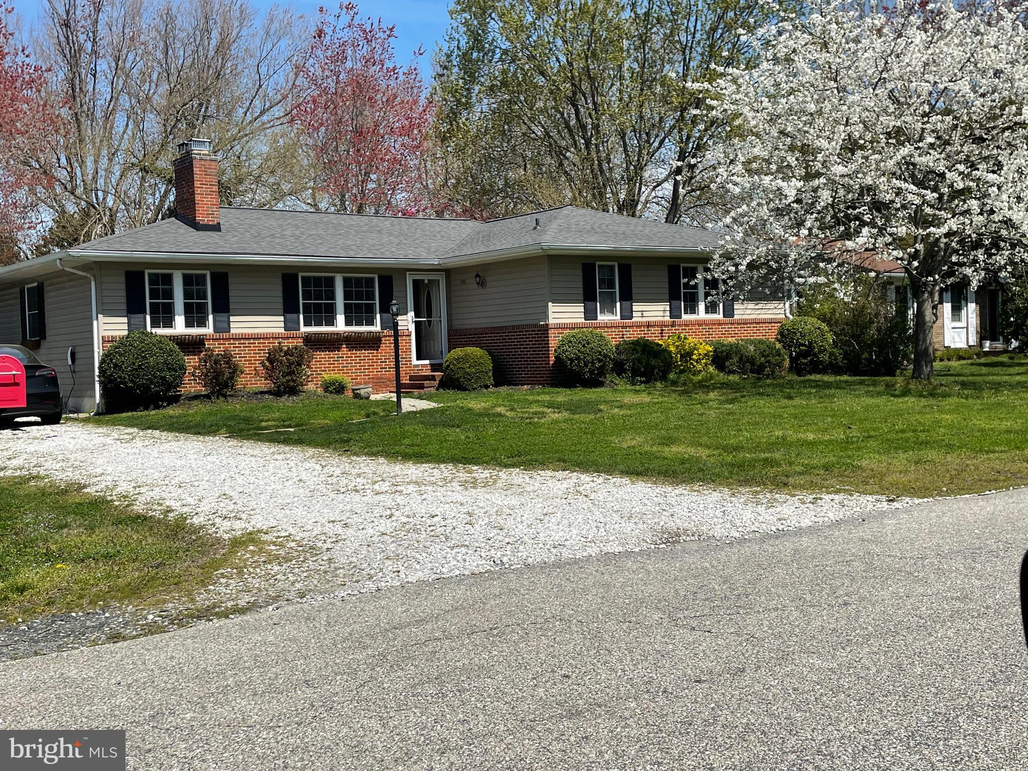 a front view of a house with a yard and porch
