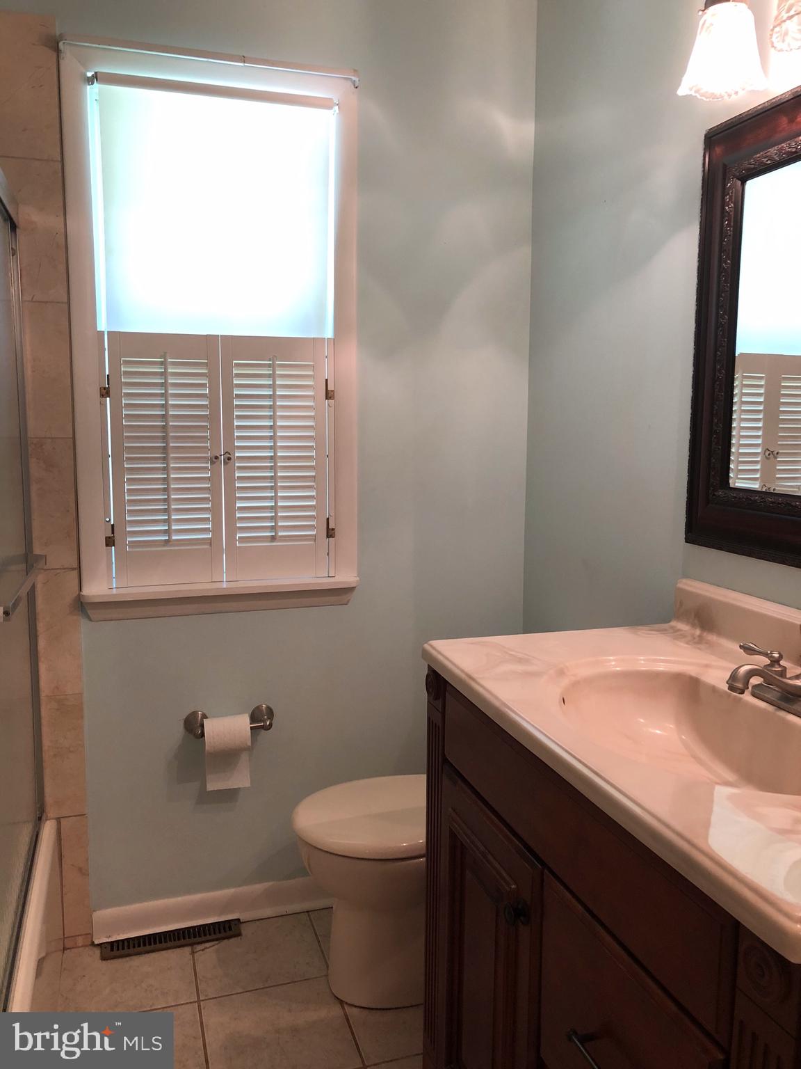 106 Boyd Drive Annapolis, MD 21403 - Photo 5 of 7 a bathroom with a sink a toilet and a window